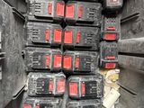 many batteries in the back of a truck that is full of them