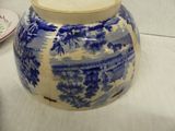 a blue and white vase sitting on a table
