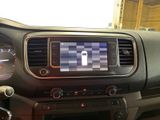 a car dashboard with a digital display in the center