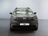 the front of a grey citrole parked in a room