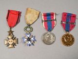 several medals are displayed on a table with a white background