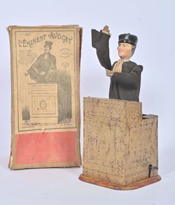 a statue of a man standing at a podium in front of a book