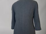 the back view of a grey jacket on a mannequin mannequin mannequin mannequin mannequin mannequin mannequin manne