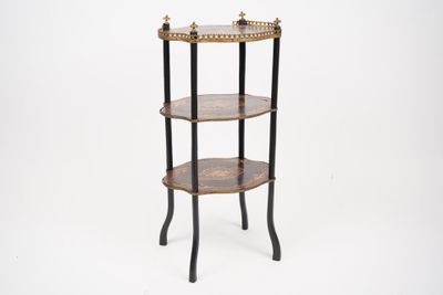 a three tiered table with a clock on top of it