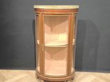 an image of a corner cabinet in the corner of a room