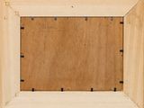 a close up of a picture of a wooden frame on a wall