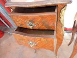 a wooden dresser with two drawers on it