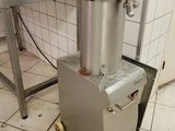 a machine that is sitting on the floor in a kitchen