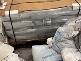 a large pile of boxes and bags on a pallet