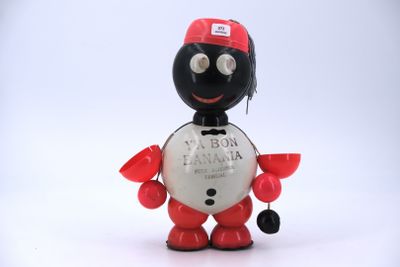 a toy figure of a man with a red hat and a black and white shirt