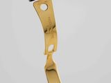 a close up of a black strap with a gold clasp