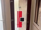 a glass door with a red and white design on it