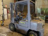 a picture of a forklift truck in a warehouse