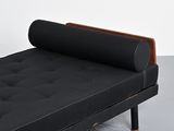 an image of a black couch with a wooden frame