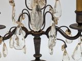 two lamps that are on a table with a black lamp shade
