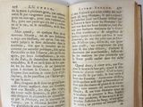an open book on a table with a white background