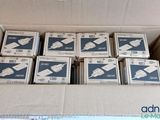 a cardboard box filled with boxes of white and blue items
