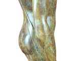 statue of a man holding a fish on a rock