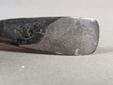 a silver spoon that is sitting on a table