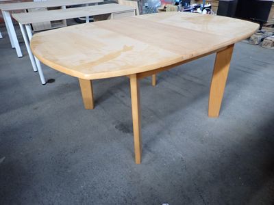 a wooden table that is sitting in the middle of a room