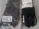 a pair of gloves and a pair of gloves sitting on a table