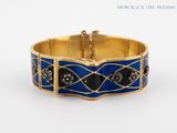 an image of a gold bracelet with blue enamel and diamonds