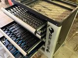 an image of a tool drawer with tools inside of it