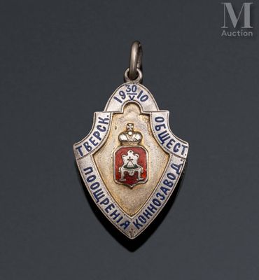 a close up of a silver and red badge on a black background