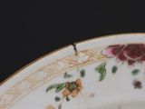a close up of a plate with flowers on it