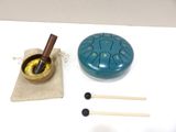a small blue bowl with a wooden stick and a small bowl with a wooden stick