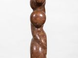 a wooden sculpture of a woman holding a child on her back