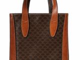 a brown and brown handbag with a dog on it