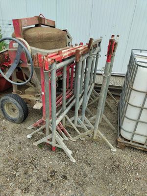 a pile of items sitting on the ground next to a building
