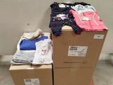 many boxes of clothing on top of each other on a pallet