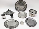 a lot of silver items that are sitting on a table