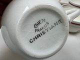 a close up of a white vase with writing on it