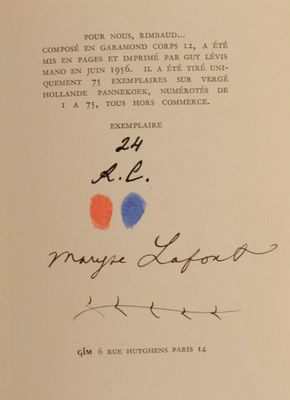 an open book with a handwritten title and a picture of a red, blue, and orange dot