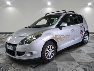 a picture of a silver car with flames painted on it
