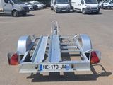 a trailer with a trailer attached to it in a parking lot