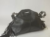 a black handbag with fringes on a white background