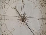 a clock that has a roman numeral on it