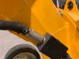 a close up of a yellow machine in a building