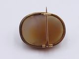 an image of a broochle of a broochle in gold