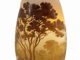 a vase that has a picture of a tree on it