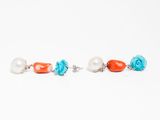a pair of earrings with coral, turquoise, and white beads