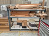 a lot of wood on the shelves in the room