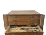an old wooden box with silverware in it on a white background