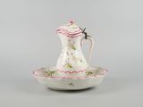 an image of a white and pink teapot on a saucer