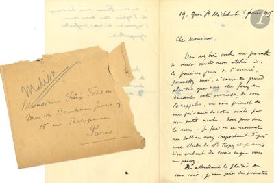 an old book with a piece of paper and a piece of paper with writing on it