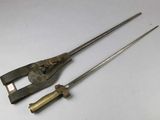 two old tools that are sitting on a white surface